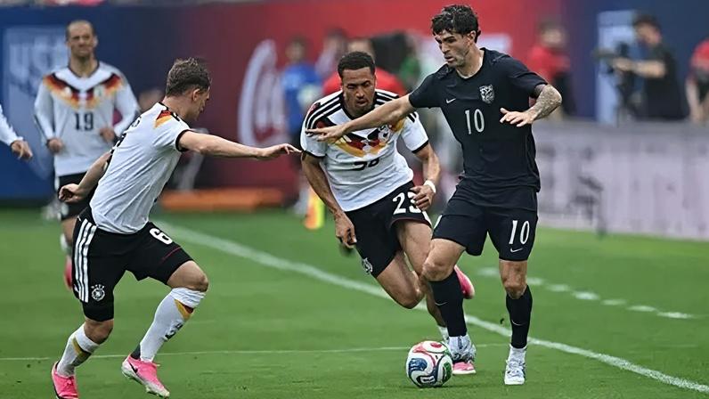 Antonee Robinson celebrates after scoring during a defeat to Germany in a World Cup warm-up game held on Saturday