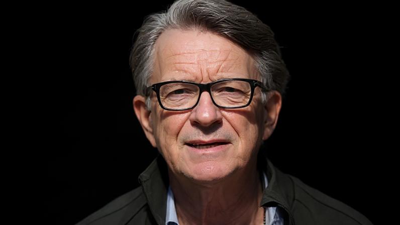 PA Media Peter Mandelson wearing glasses, and an open necked shirt and jacket