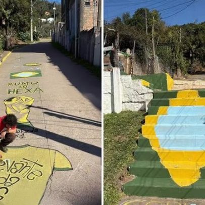 Comunidade de Porto Alegre pinta ruas com taça e bandeira para a Copa do Mundo