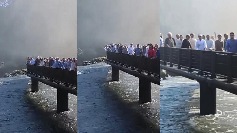 Turista se pendura e tenta subir na passarela — Foto: Reprodução/ Rede Sociais