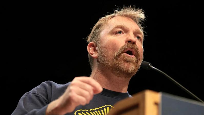 Democratic U.S. Senate candidate Graham Platner speaks at a “Fighting Oligarchy” tour stop on the University of Maine campus on May 24, 2026.