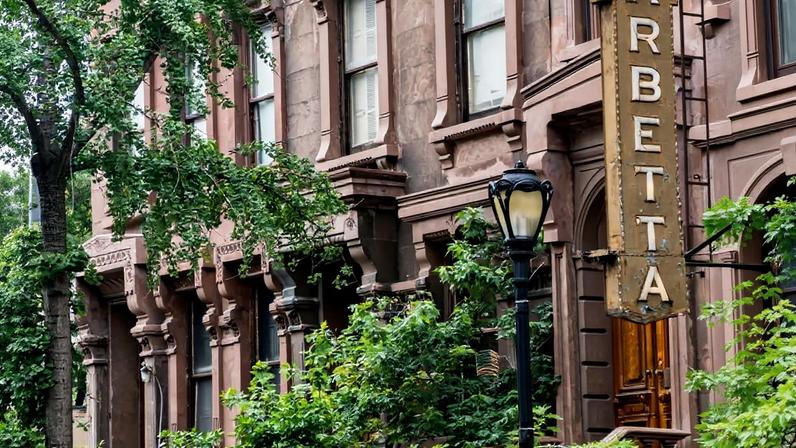 New York City, USA – August 3, 2016: People On 46th Street Outside A Group Of Row Houses And Barbetta Restaurant – Close To Broadway and Times Square In Midtown Manhattan