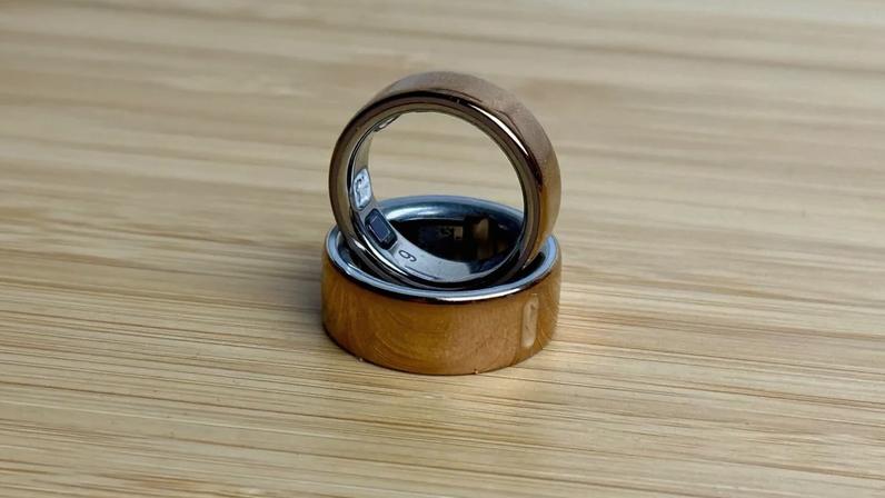 Oura Ring 5 on top of Oura Ring 4. You can see the small but distinct size difference between the rose gold smart rings.