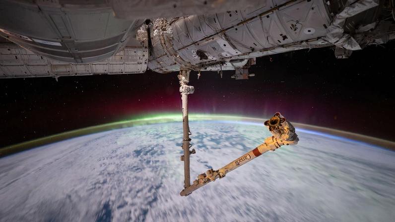The aurora australis crowns Earth’s atmosphere in this photograph taken at approximately 3:13 a.m. local time from the International Space Station as it orbited 269 miles above the Indian Ocean east of the French Southern and Antarctic Lands. In the foreground, the Canadarm2 robotic arm extends from a power and data grapple fixture attached to the Harmony module.
