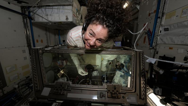 NASA astronaut and Expedition 74 flight engineer Jessica Meir nourishes stem cell samples inside the Kibo laboratory module’s Life Science Glovebox aboard the International Space Station. The stem cell samples were incubated to help researchers learn how to manufacture space‑designed therapies to treat cancer and blood disorders.