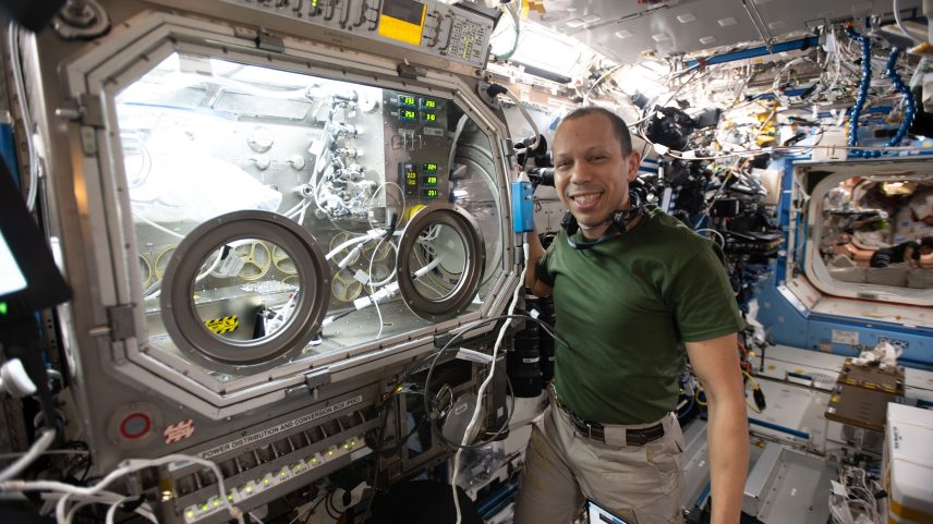 NASA astronaut and Expedition 74 flight engineer Chris Williams shows off the Destiny laboratory module’s Microgravity Science Glovebox aboard the International Space Station. WIlliams was supporting semiconductor crystal research to help advance the commercial space economy and promoting Earth-based industries.