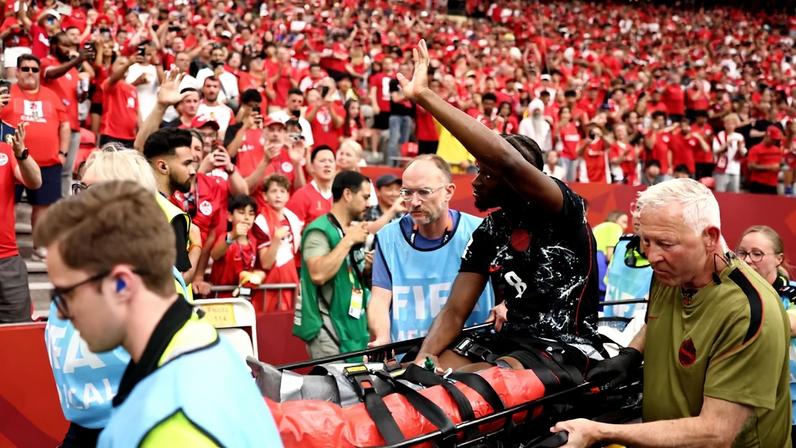 VANCOUVER, BRITISH COLUMBIA - JUNE 18: Ismael Kone #8 of Canada waves to crowd as he is stretched off after being fouled by Assim Madibo #23 of Qatar during the FIFA World Cup 2026 Group B match between Canada and Qatar at BC Place Vancouver on June 18, 2026 in Vancouver, British Columbia. Fran Santiago/Getty Images/AFP