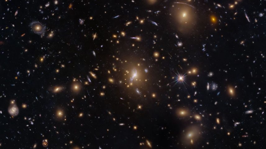 This NASA Hubble Space Telescope image features the galaxy cluster MACS0329-0211.
