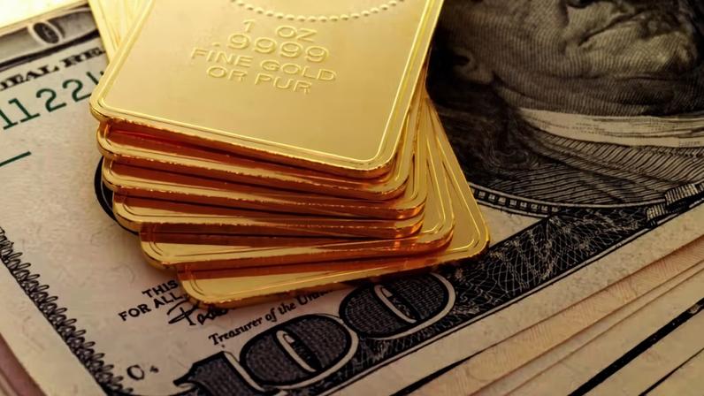 Ouro sobre o dólar — Foto: Gettyimages