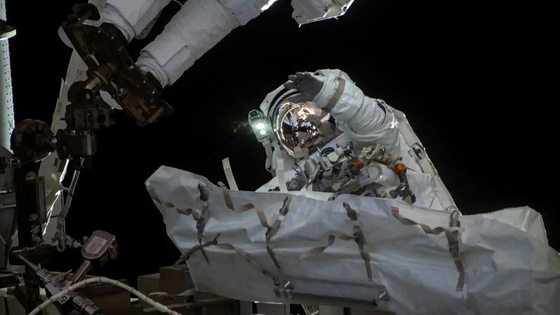 NASA astronaut Jessica Meir waves at the camera during a seven-hour, two-minute spacewalk outside the International Space Station on March 18, 2026.