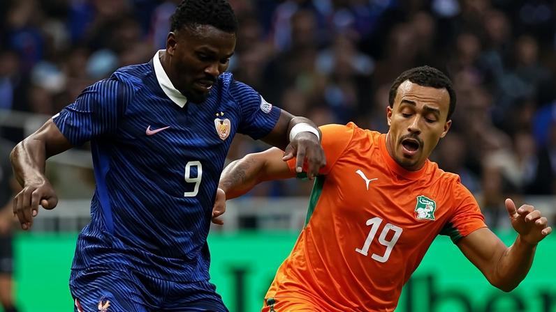 Thuram, da França, protege a bola em disputa com Guéla Doué, da Costa do Marfim
