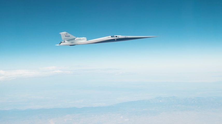 NASA’s X-59 in flight on June 12, 2026 against a blue sky.