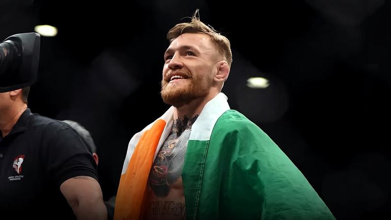 Conor McGregor celebrates after defeating Jose Aldo in their featherweight championship bout during the UFC 194 event inside MGM Grand Garden Arena