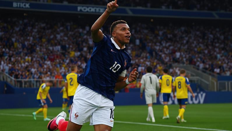 France's Kylian Mbappe celebrates scoring their third goal