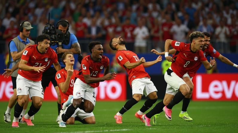 Egypt players celebrate after Hossam Abdelmaguid scores the penalty past Australia's Mathew Ryan to win the shoot-out as Egypt qualify for the Round of 16 stage of the World Cup