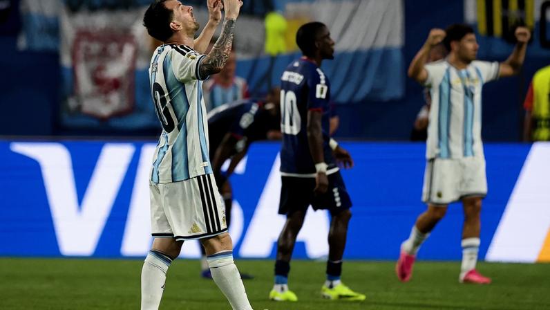 Argentina's Lionel Messi celebrates after the match as Argentina qualify for the Round of 16 stage of the World Cup