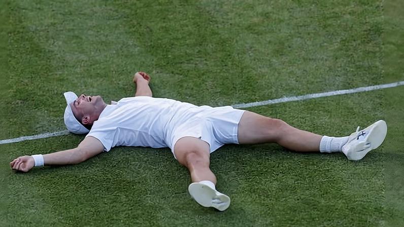Arthur Fery lying on a tennis court