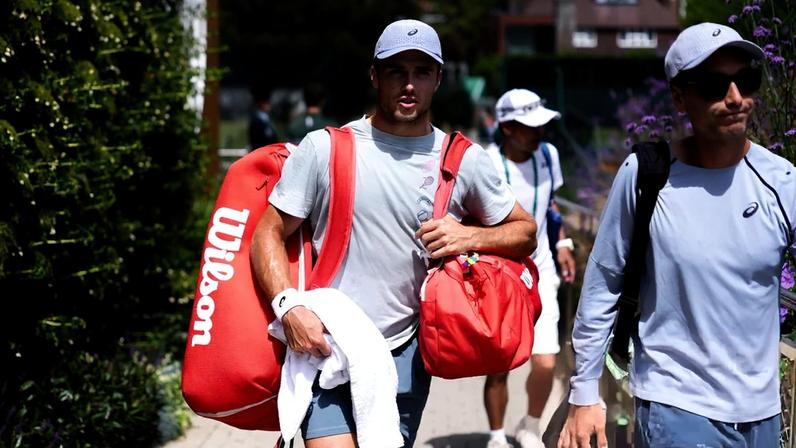 Arthur Fery makes his way to the Wimbledon practice courts to prepare for his match against Grigor Dimitrov.