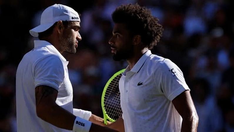 Matteo Berrettini (left) drew on his experience to see off Arthur Fils.