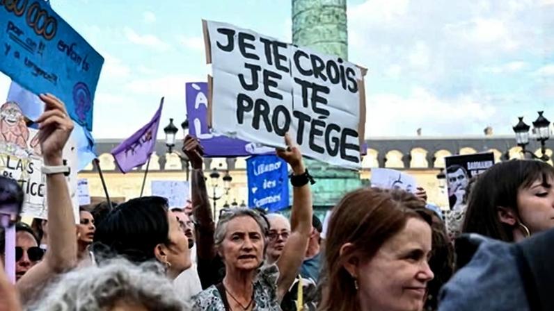 A protest outside the French Justice Ministry, Paris, on 29 June to demand a law against violence on minors, following the death of Lyhanna. The placard reads: ‘I believe you, I protect you’. Photograph: Julie Sebadelha/AFP/Getty Images