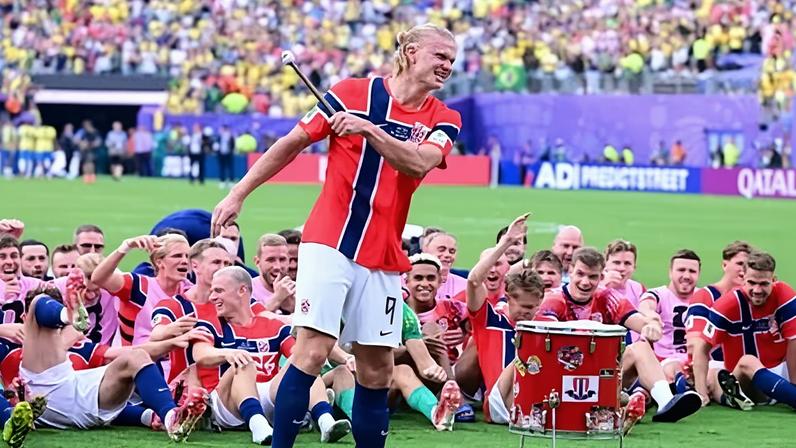 Erling Haaland beats the drum during Norway post-game celebrations on the pitch after his goals defeated Brazil in the World Cup last-16 tie.