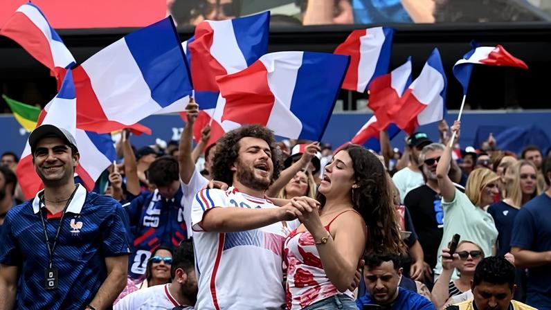 France fans celebrate in the stands during their group-stage game in Philadelphia.