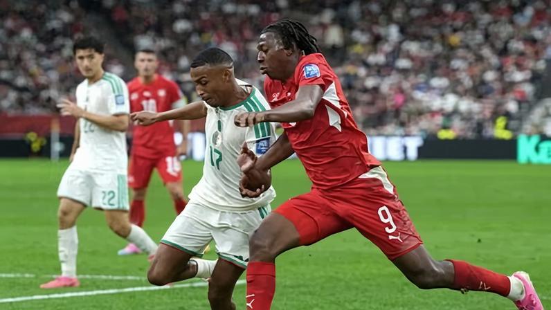 Johan Manzambi takes the ball to the touchline before setting up Breel Embolo to score in Switzerland’s 2-0 win over Algeria.