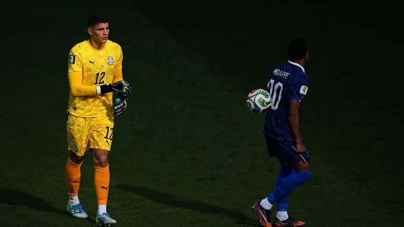 Paraguay 'keeper Orlando Gill throws the ball at Kylian Mbappe after the last-16 tie
