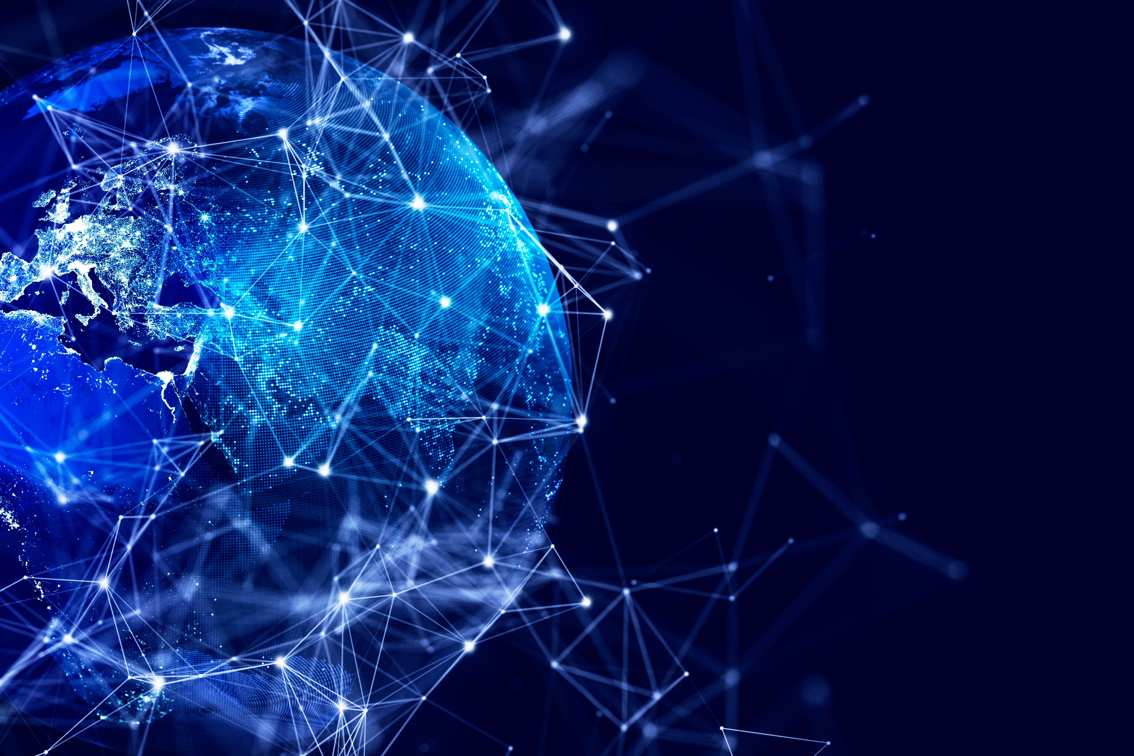 Interoperabilidade em blockchain enfrenta desafios para garantir tecnologia futura Um mapa digital da Terra e uma enorme rede. (Foto: Getty Images/Reprodução)